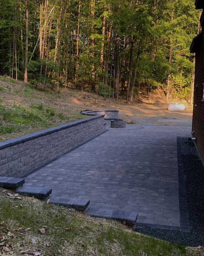 A stone retaining wall built into a hillside